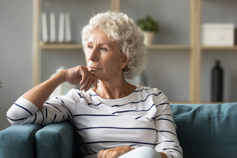 a dental implant patient thinking about a dental implant surgery