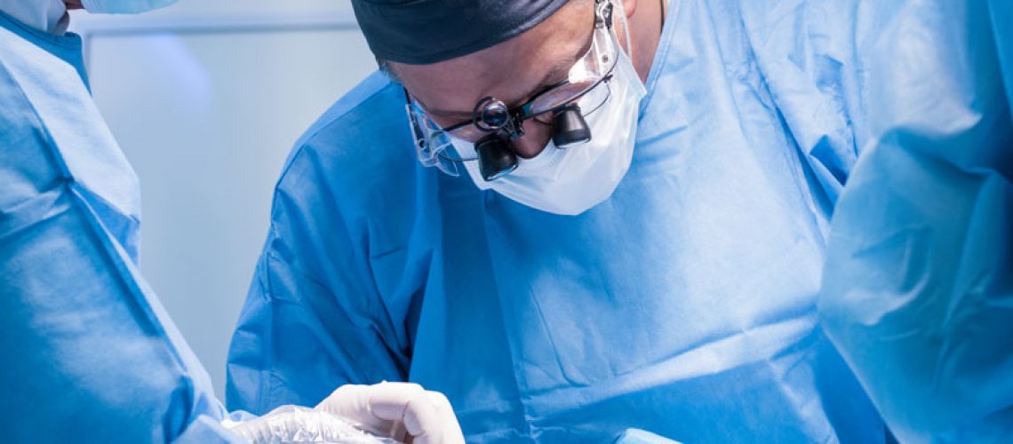 oral surgeon performing a dental procedure