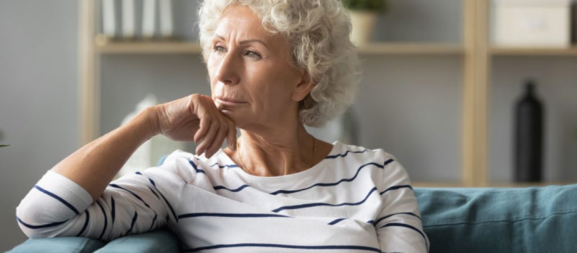 a dental implant patient thinking about a dental implant surgery